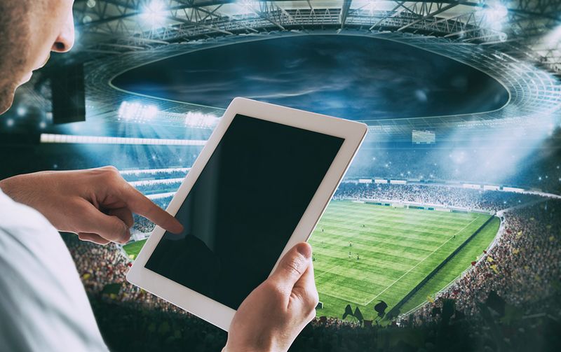 Betting on tablet in football stadium