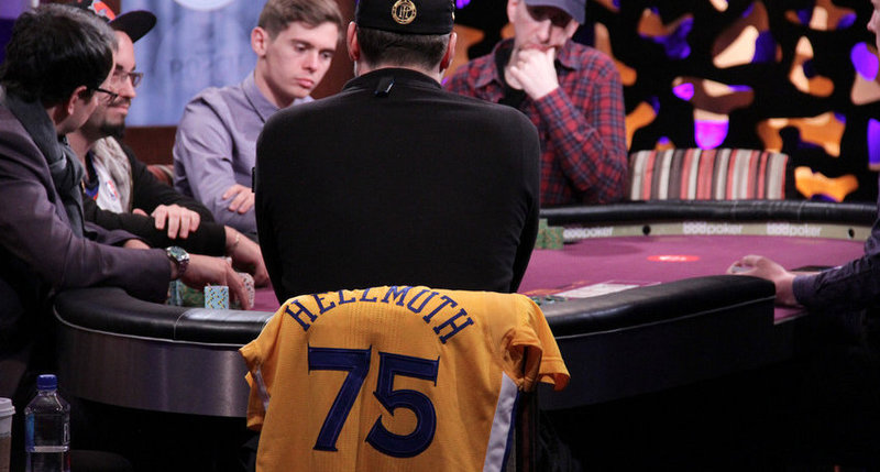Phil Hellmuth and Warriors jersey at the poker table.