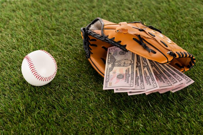 dollars and baseball glove