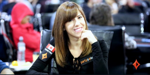 Kristen Bicknell happy and smiling at a poker table.