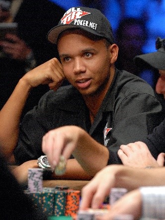 Phil Ivey giving a little smile at the poker table.