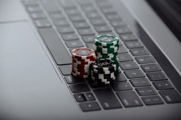 Poker chips on a laptop.