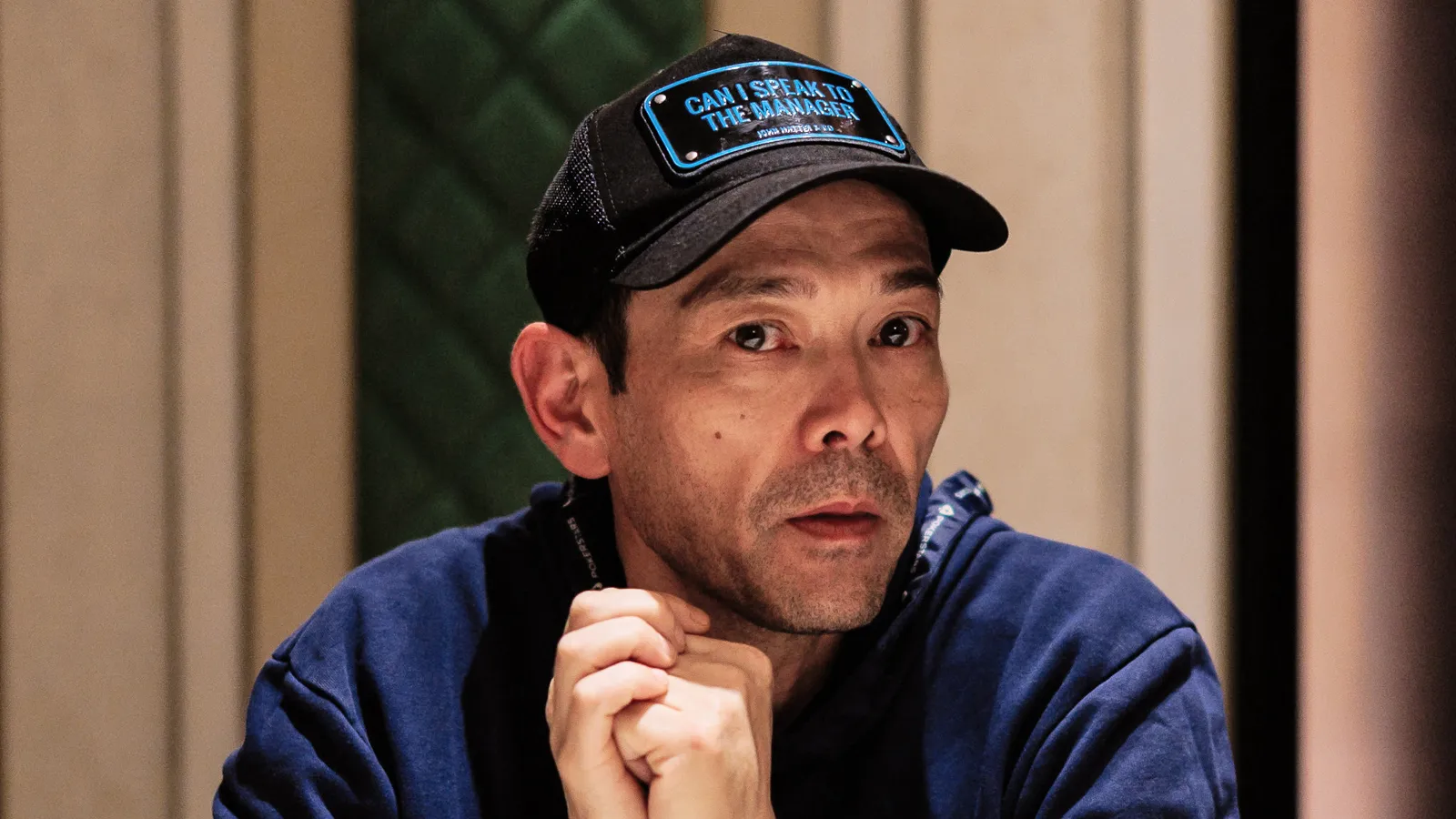 Terje Bremseth interview on pokerlistings.com in front of poker table.