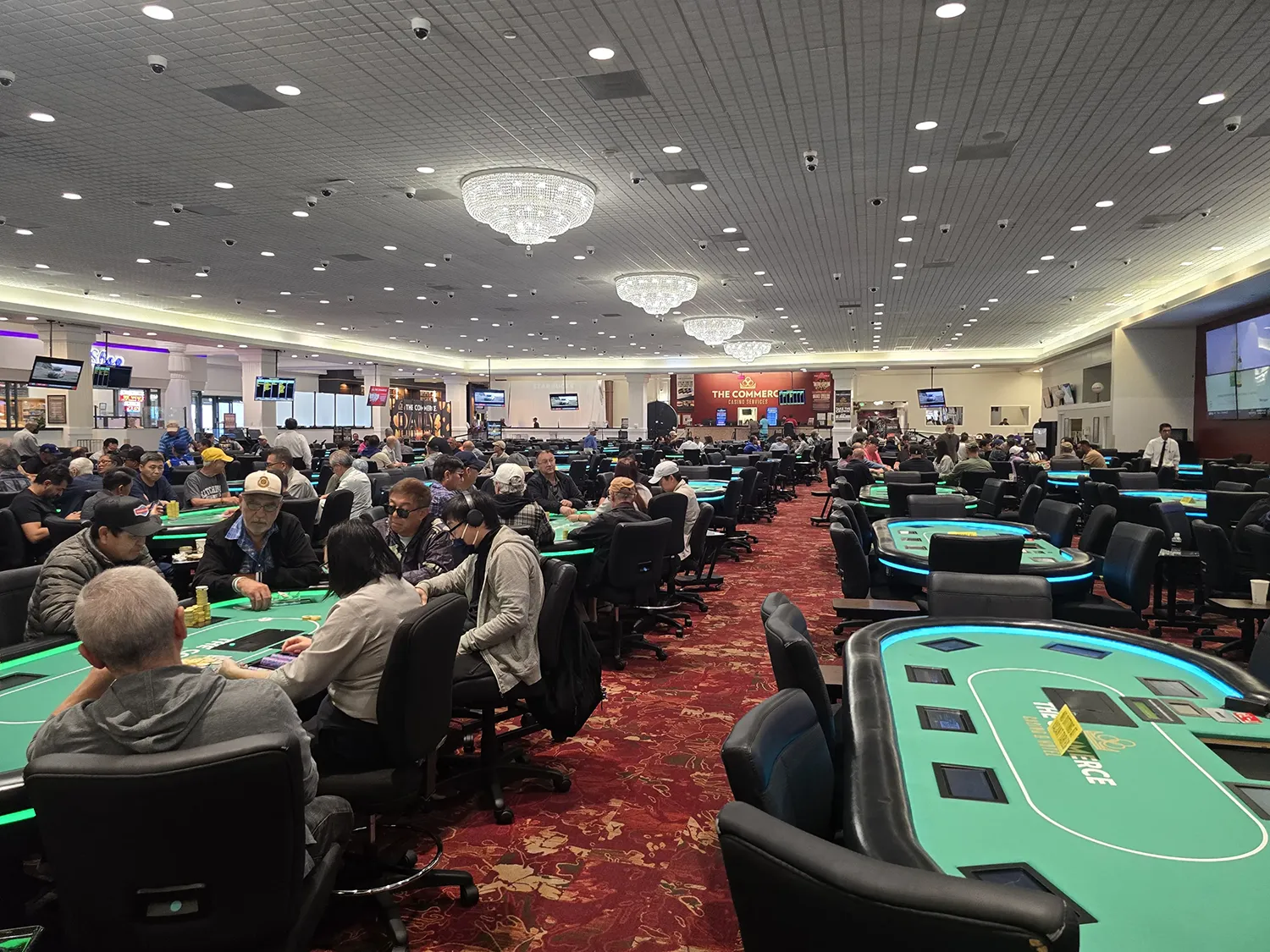 Crowded poker room in the Commerce Casino in California.