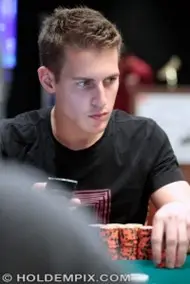 Mike McDonald staring at the board while in a poker hand.
