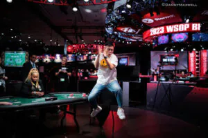 Pengfei Wang jumps for joy upon winning the bracelet