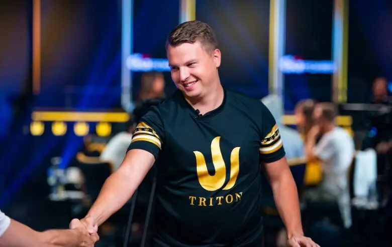Aleksejs Ponakovs concentrates intently during a high-stakes live poker tournament.