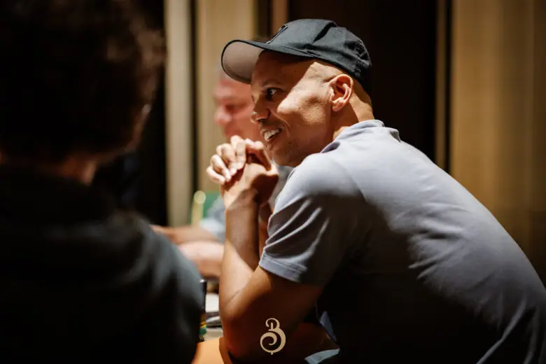 Phil Ivey is sitting at the poker table.