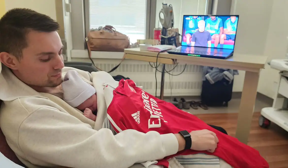 Beriuzy with his newborn daughter