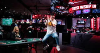 Pengfei Wang jumps for joy upon winning the bracelet