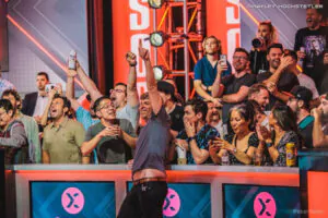 Adam Walton, leader of the Main FT, celebrates with rail during Day 9 action