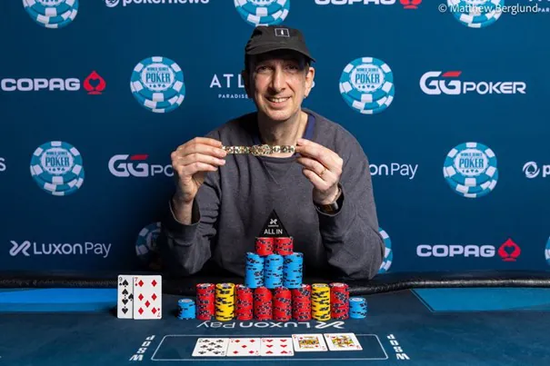 Eric Seidel proudly posing with bracelet number 10 after winning the $50 000 Super High Roller at WSOP Paradise. 
