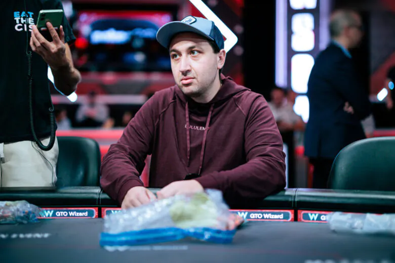 Jordan Griff in a casual setting, analyzing a deck of cards with a thoughtful smile.