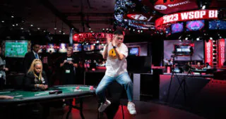 Pengfei Wang jumps for joy upon winning the bracelet